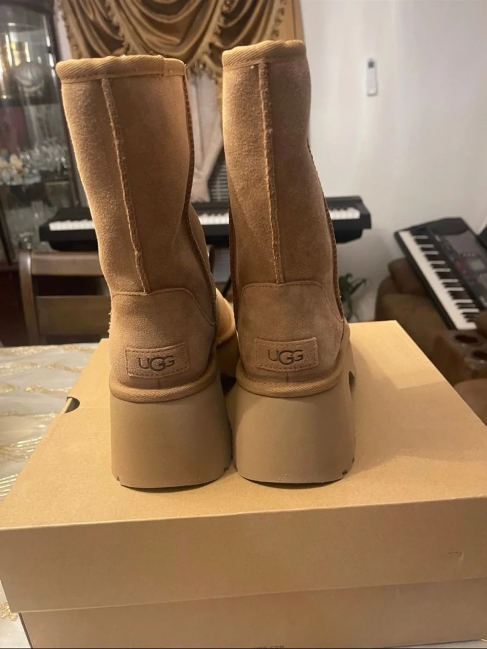 UGG Women's classic short new heights bootie’s size 7